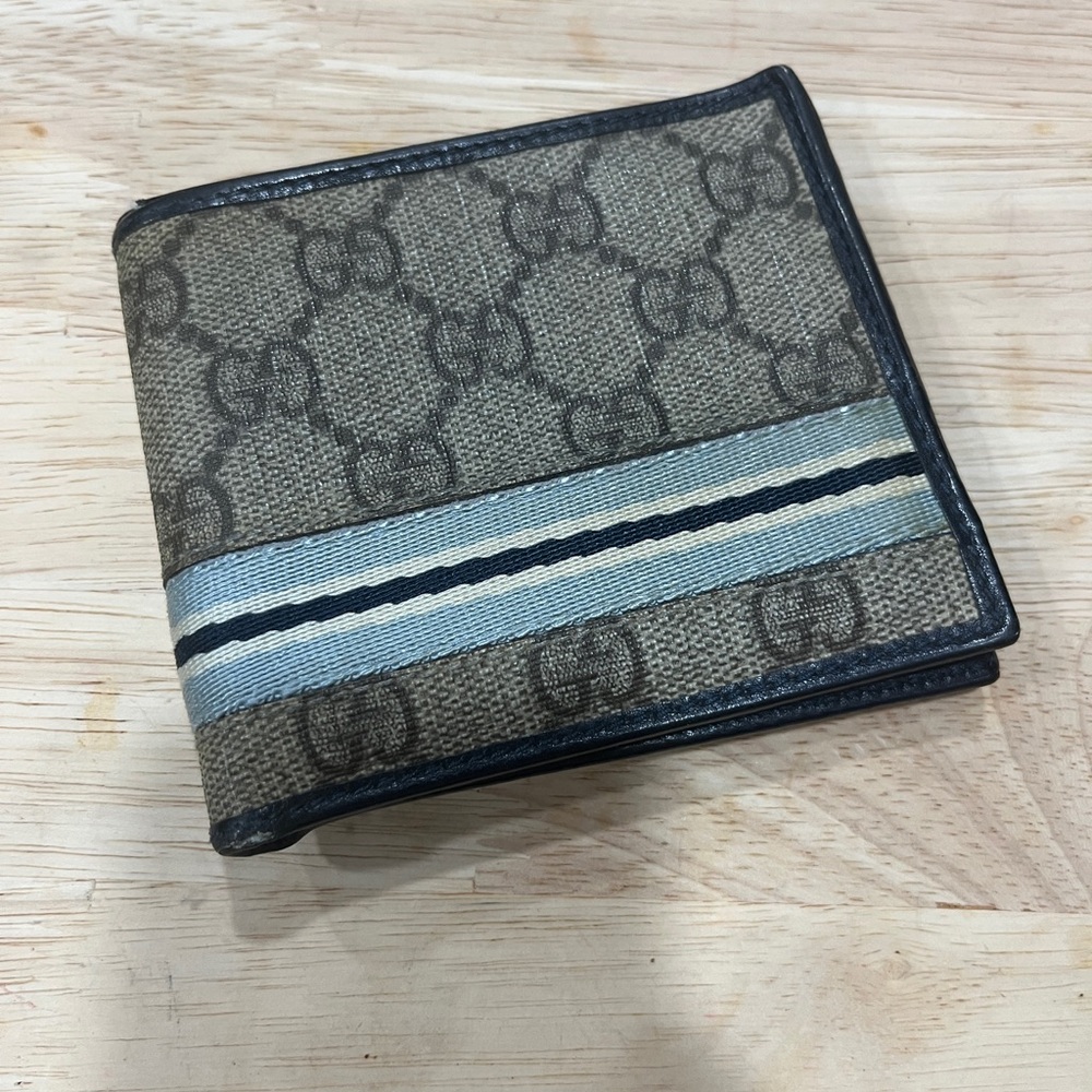 Gucci GG Supreme canvas bi-fold wallet with a blue and white web stripe